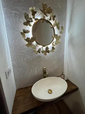 a bathroom with a sink and a mirror on a wall at HOTEL CASAS DA FORTALEZA Casa do Garda in Outeiro de Rei