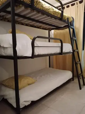 a bunk bed room with two bunk beds in a room at Apartamento Oceano in Barreiros