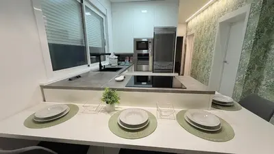 a kitchen with a table with four plates on it at Jabego2 in Sarria