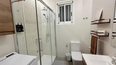 a bathroom with a glass shower and a toilet at Jabego2 in Sarria