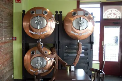 a group of three toasters hanging on a wall at Hotel Torques in A Coruña