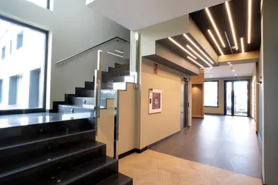 a hallway with a staircase in a building at HOTEL RIO LEA in Castro de Rey