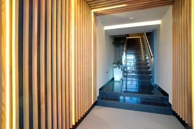 a staircase in a building with wooden walls at HOTEL RIO LEA in Castro de Rey