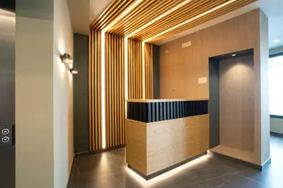 a lobby with a reception desk in a building at HOTEL RIO LEA in Castro de Rey