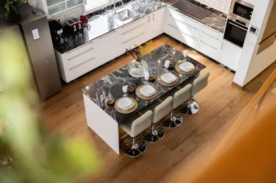 an overhead view of a kitchen with a table and chairs at La Casa del Camino in Santiago de Compostela