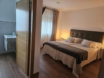 a bedroom with a large bed in a room at La Casa del Camino in Santiago de Compostela