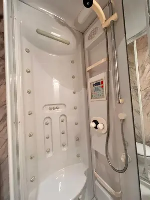a bathroom with a shower and a toilet at Apartamentos San Martín Ourense Centro 1 in Ourense