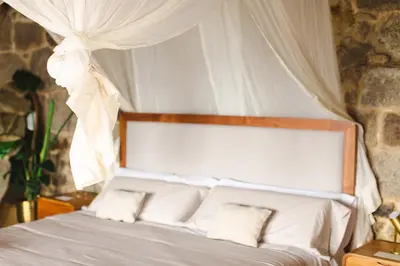 a bedroom with a white bed with a canopy at Apedeceo Belesar Villa, Ribeira Sacra, Galicia in Chantada