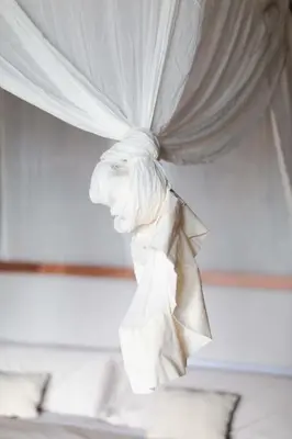 a white curtain on a bed in a bedroom at Apedeceo Belesar Villa, Ribeira Sacra, Galicia in Chantada