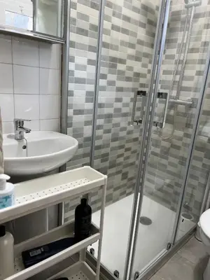 a bathroom with a shower and a sink at Viviendas uso turístico REME I in Foz