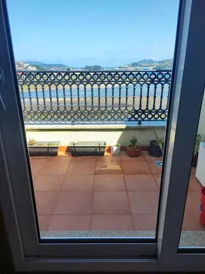 a view of a balcony with a view of the water at MARINA SOL VIVEIRO in Viveiro