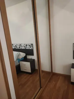 a mirror in a room with a bed at MARINA SOL VIVEIRO in Viveiro