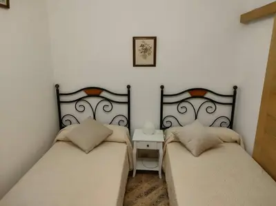 two beds sitting next to each other in a bedroom at Piso centrico en Ribadeo in Ribadeo