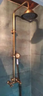 a shower in a bathroom with a shower head at Casita de Florita in Doade