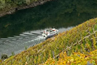 a boat traveling down a river with people on it at Casita de Florita in Doade
