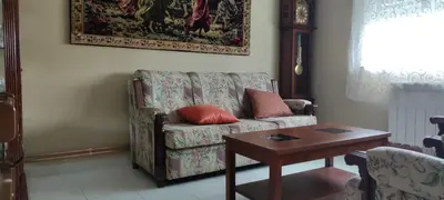a living room with a couch and a table at Casa Eusebio de Veva in Rinlo
