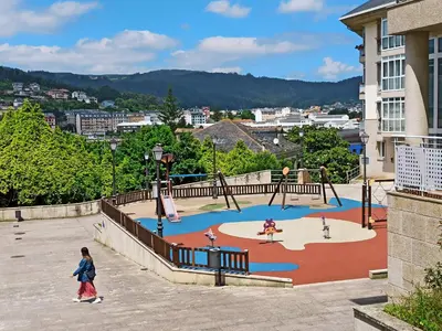 a child walking around a playground in a city at San Francisco in Viveiro