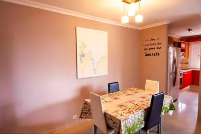 a dining room with a table and a table and chairs at San Francisco in Viveiro