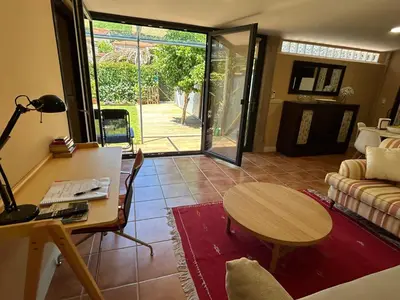 a living room with a table and a couch at COTOLAI in Santiago de Compostela
