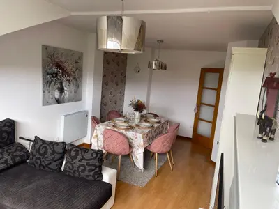 a living room with a table and a couch at Suite Azucarera in Iria