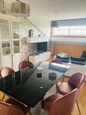 a dining room with a glass table and chairs at Suite Azucarera in Iria