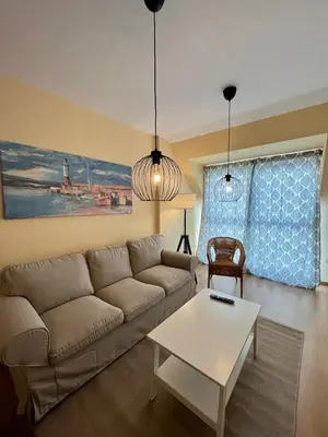 a living room with a couch and a table at Centro de Miño - Pumariega in Miño
