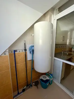 a kitchen with a sink and a water tank at Centro de Miño - Pumariega in Miño