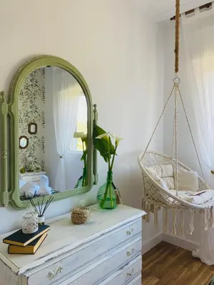 a mirror on top of a dresser in a room at Bodega Sibeiro in Chantada