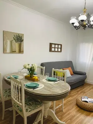 a living room with a table and a couch at Bodega Sibeiro in Chantada