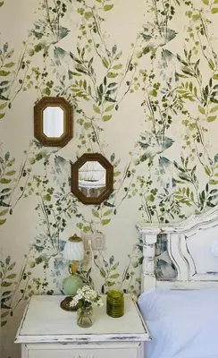 a bedroom with a wall with a floral wallpaper at Bodega Sibeiro in Chantada