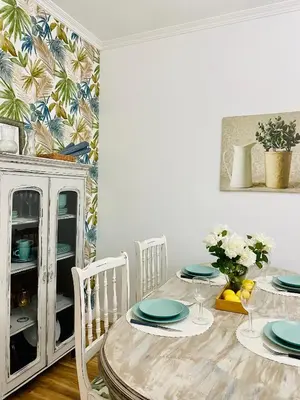 a dining room with a table with plates on it at Bodega Sibeiro in Chantada