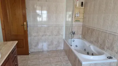 a large bathroom with a tub and a shower at Mirador del castillo in Monforte de Lemos