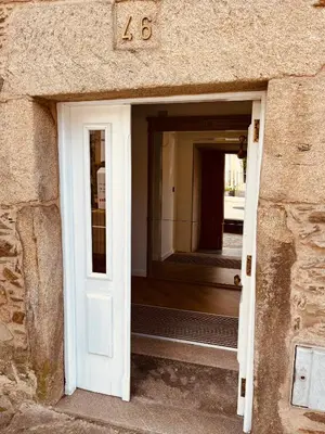 an open door in a stone building with a number sidx sidx at Villa Clásica en Santiago 
