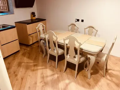 a kitchen with a dining room table and chairs at Villa Clásica en Santiago 